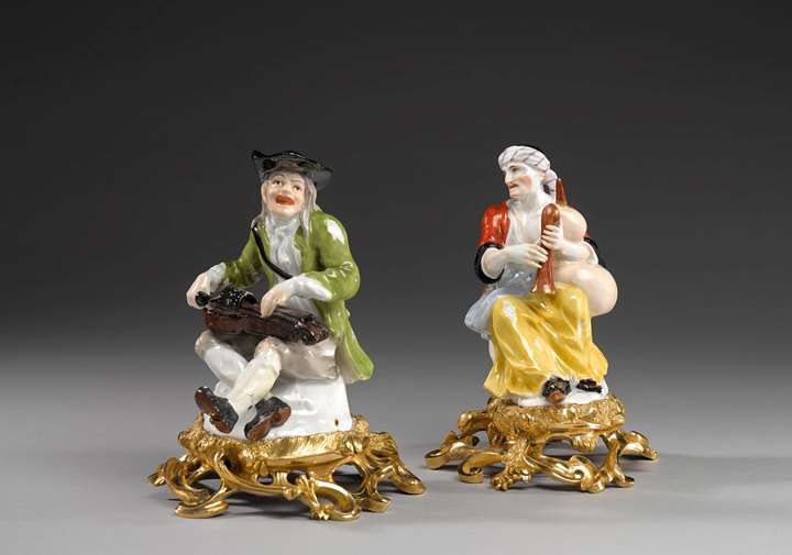A pair of ormolu mounted beggar musicians